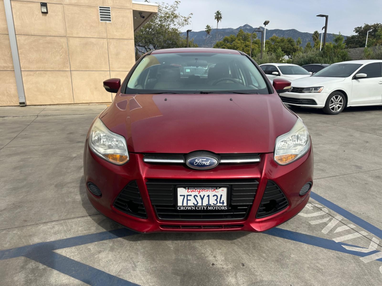 2014 RED /Gray Ford Focus Cloth (1FADP3K24EL) with an 4 Cylinders engine, Automatic transmission, located at 30 S. Berkeley Avenue, Pasadena, CA, 91107, (626) 248-7567, 34.145447, -118.109398 - Good Value! Good MPG! - Photo #1